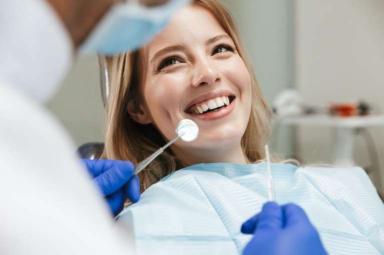 woman getting her teeth cleaned in edwardsville il