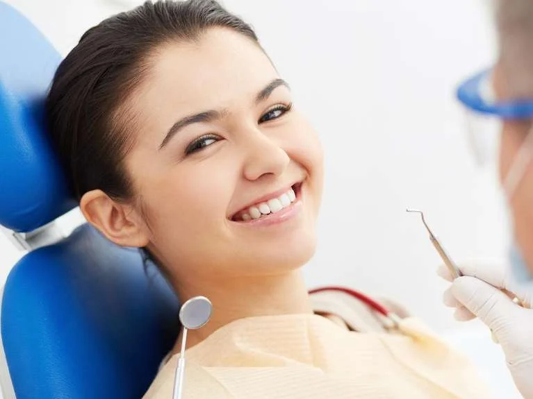Smiling woman in the dental chair